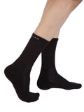 Three pairs of black crew length cotton socks with cushioning for both men and women by Air Garb, packaged as a convenient 3-pack.